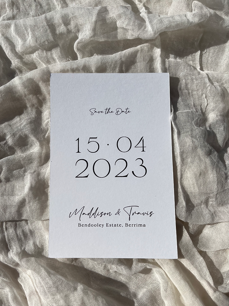 White, rectangle save the date on white cheesecloth fabric.