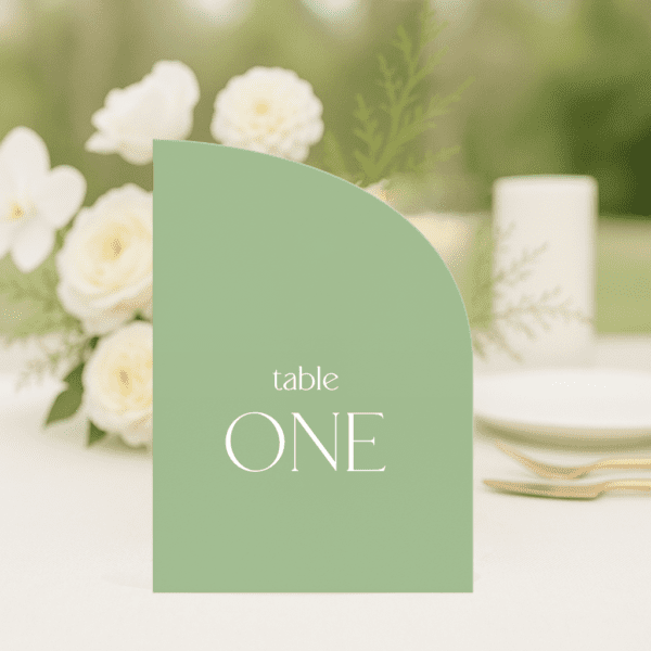 Evermore wedding table number in half arch shape featuring romantic, modern fonts and soft colour palette, styled for an elegant reception table.