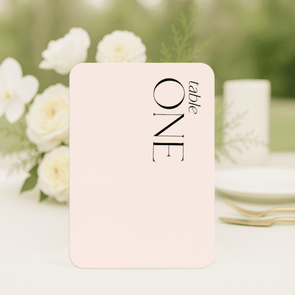 Sam wedding table number in rounded corners shape featuring romantic, modern fonts and soft colour palette, styled for an elegant reception table.