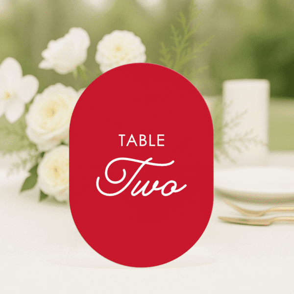 Love Bug wedding table number in double arch shape featuring romantic, modern fonts and soft colour palette, styled for an elegant reception table.
