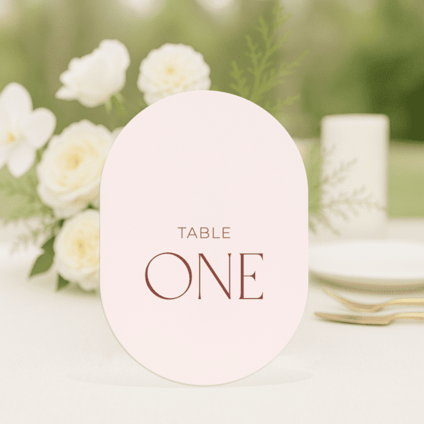 Beloved wedding table number in arch shape featuring romantic, modern fonts and soft colour palette, styled for an elegant reception table.