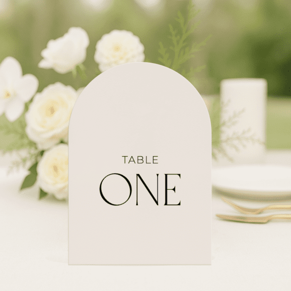 Beloved wedding table number in arch shape featuring romantic, modern fonts and soft colour palette, styled for an elegant reception table.