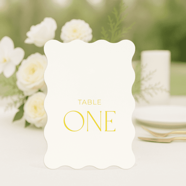 Beloved wedding table number in arch shape featuring romantic, modern fonts and soft colour palette, styled for an elegant reception table.