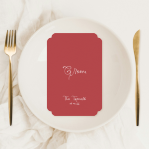 Double-sided semi-custom wedding menu with elegant layout and personalised guest name, styled on a romantic table setting.